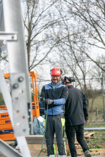 Professional Cteam construction team on site with safety gear preparing for installation. Professional Cteam construction team on site with safety gear preparing for installation.